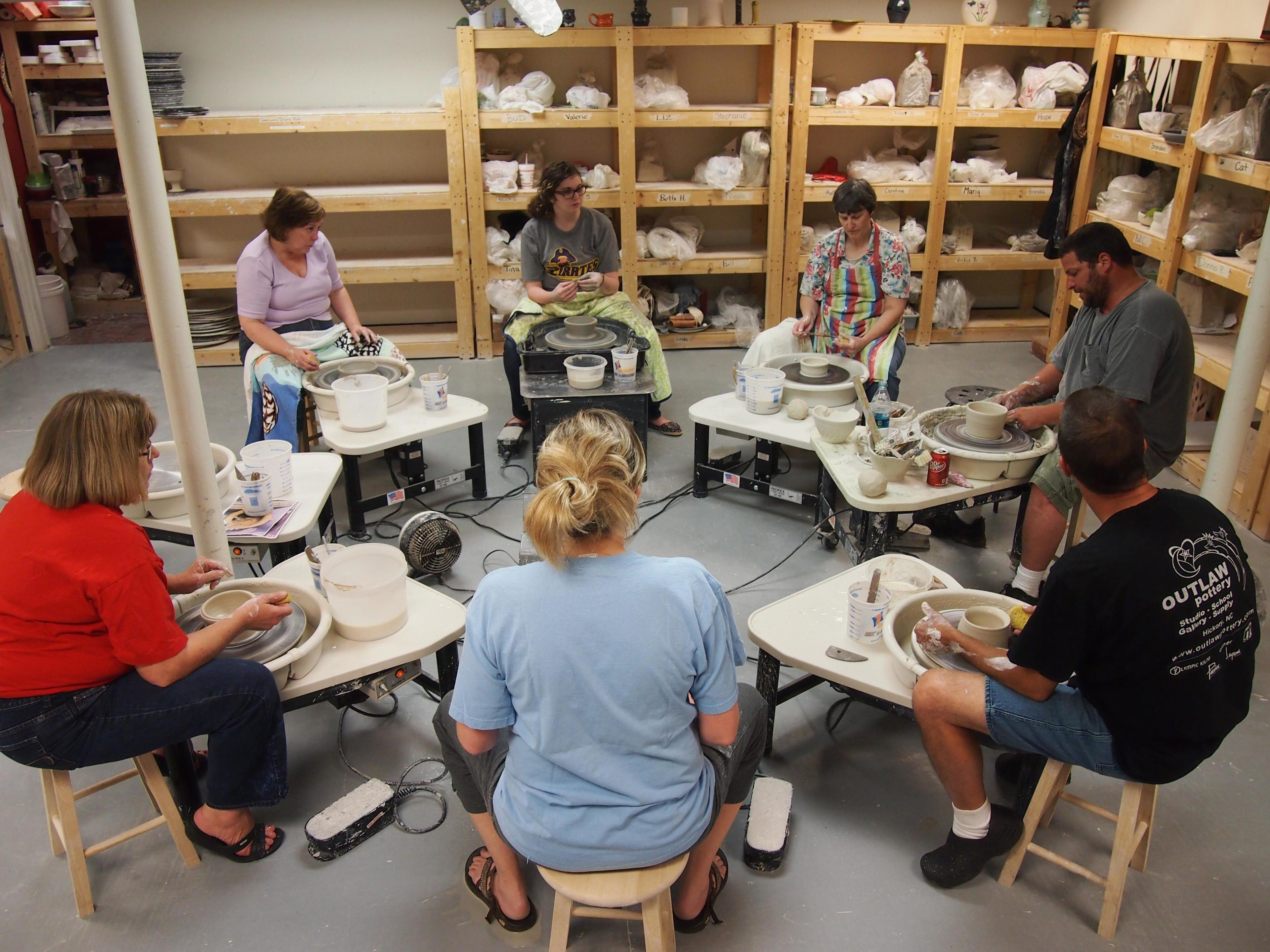 Wheel-throwing pottery class at Outlaw Pottery School