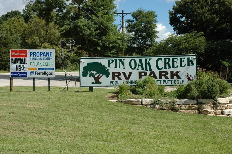 Pin Oak Creek RV Park and Paintball, St. Louis Missouri family campground entrance sign, paintball, swimming, fishing