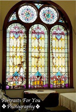 One of the two large stained glass windows