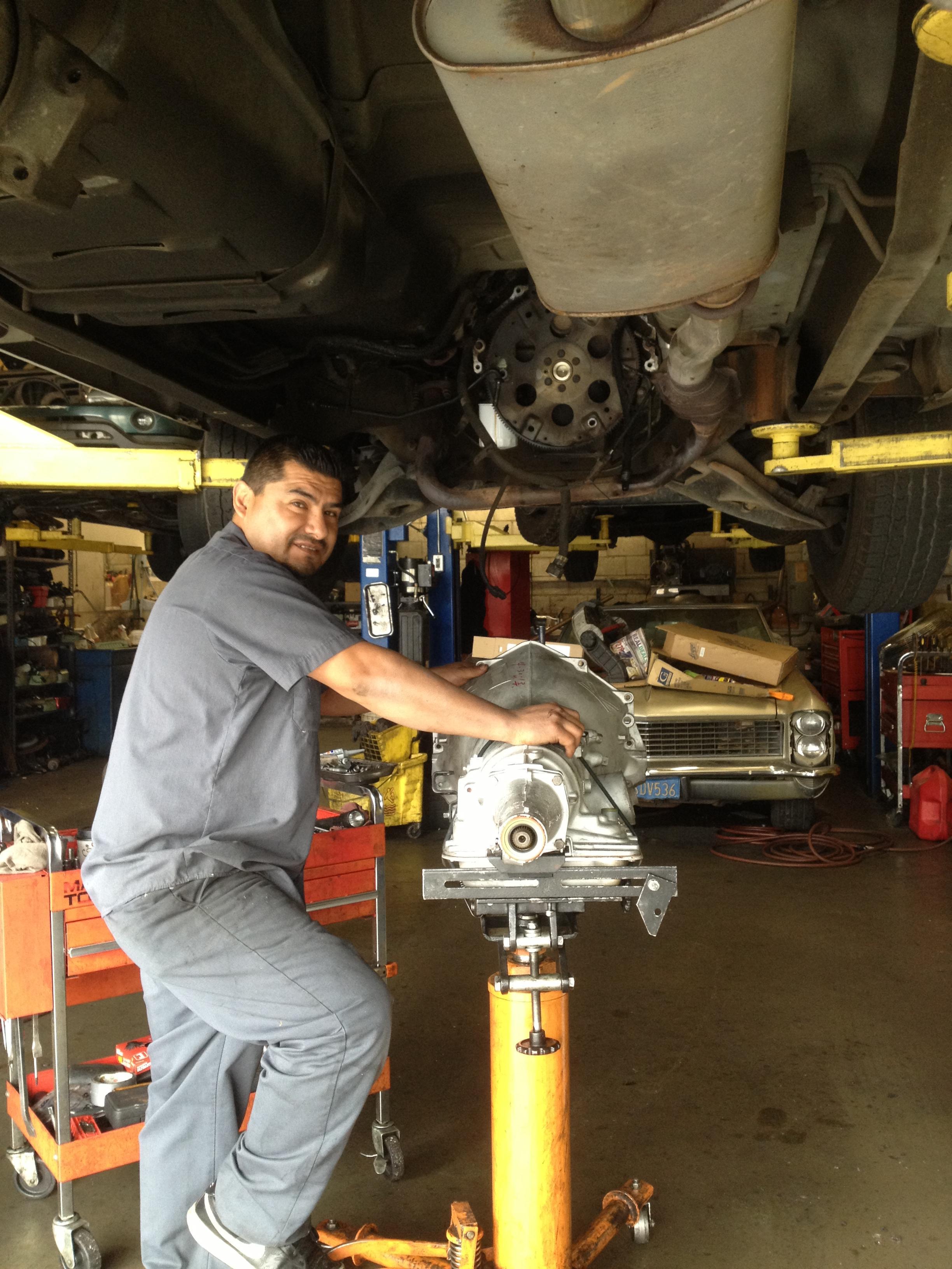 Carlos working on a transmission