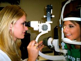 Dr. Dobson examining a contact lens patient.