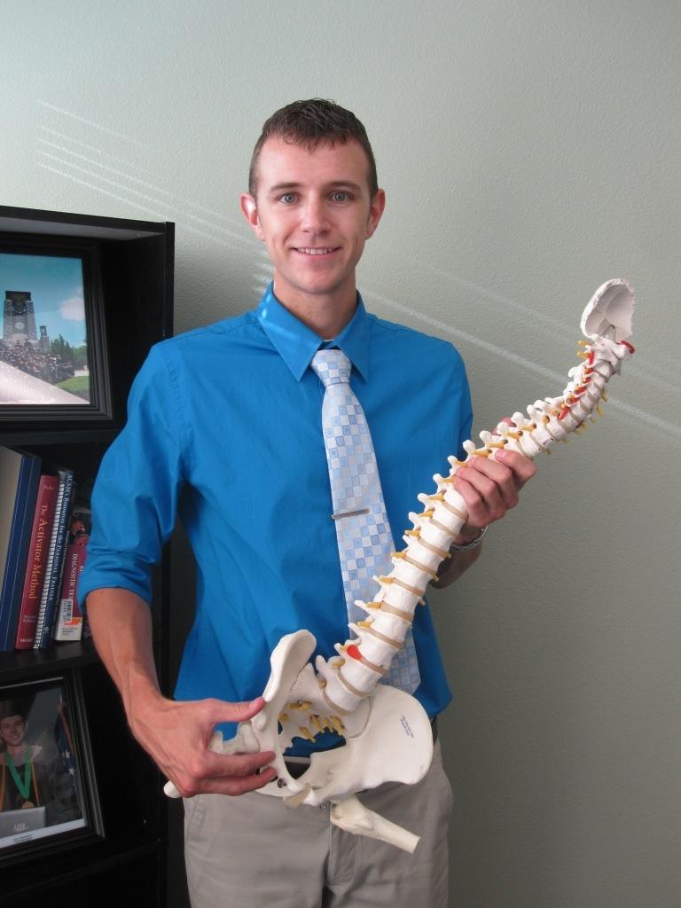 Dr. Patrick Stromer and a spine model