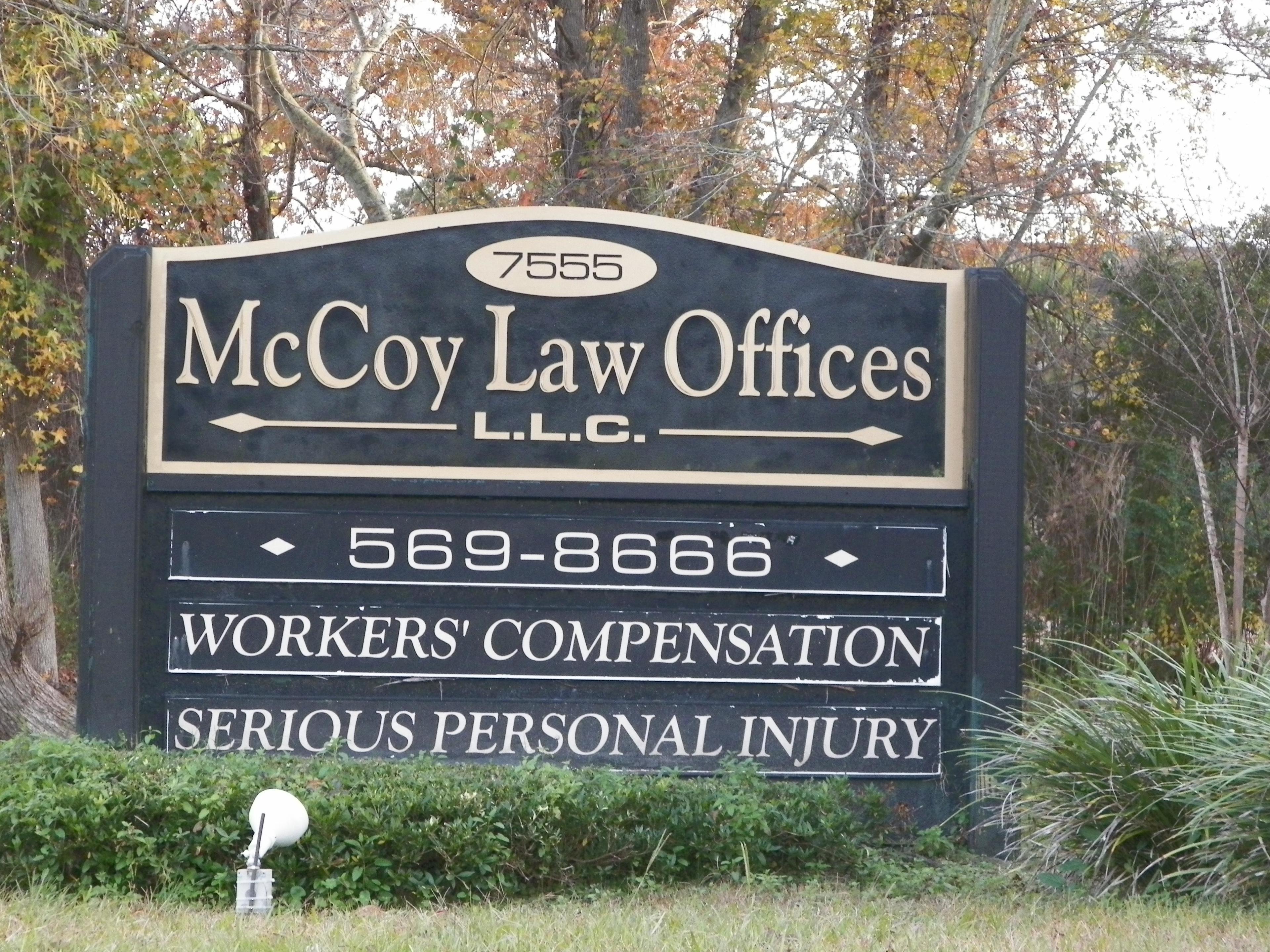 McCoy Law Firm sign at front; clearly marked offices off of the frontage road