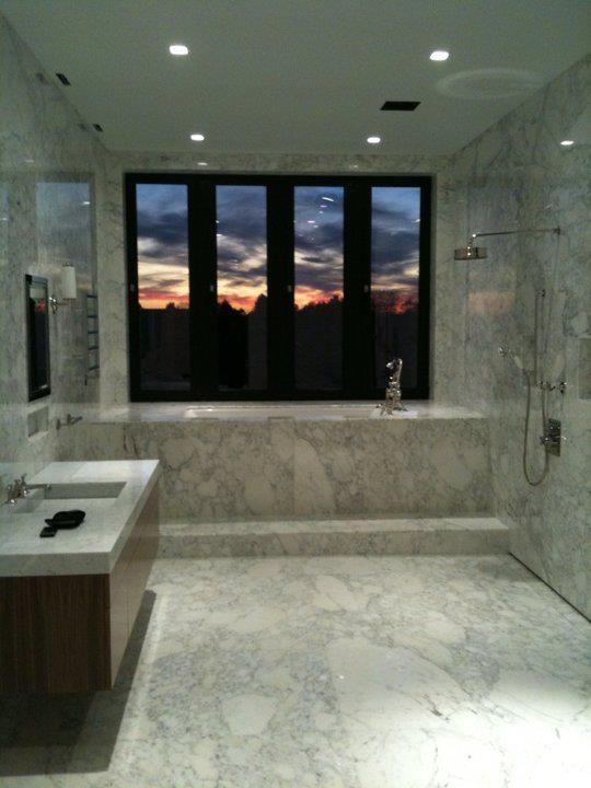 We used 20 full slabs of marble on the floors and walls, around the tub. We made the vanity and the marble top with the sink.