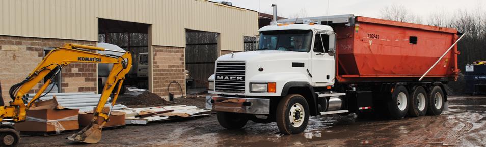 One of our larger dumpsters, in site being hauled away.