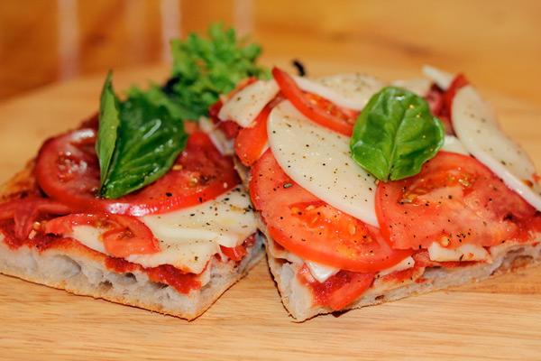 Caprese pizza slice