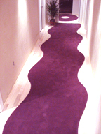 Walk through clay finished walls on plush wave carpet.