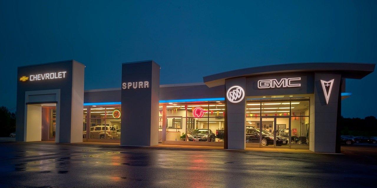 Spurr Dealerships at night