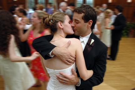 Ann Arbor wedding couple kiss during their wedding reception in Michigan.