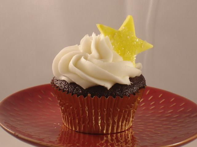 Chocolate Delight cupcake filled with chocolate chunk filling topped with a white buttercream frosting