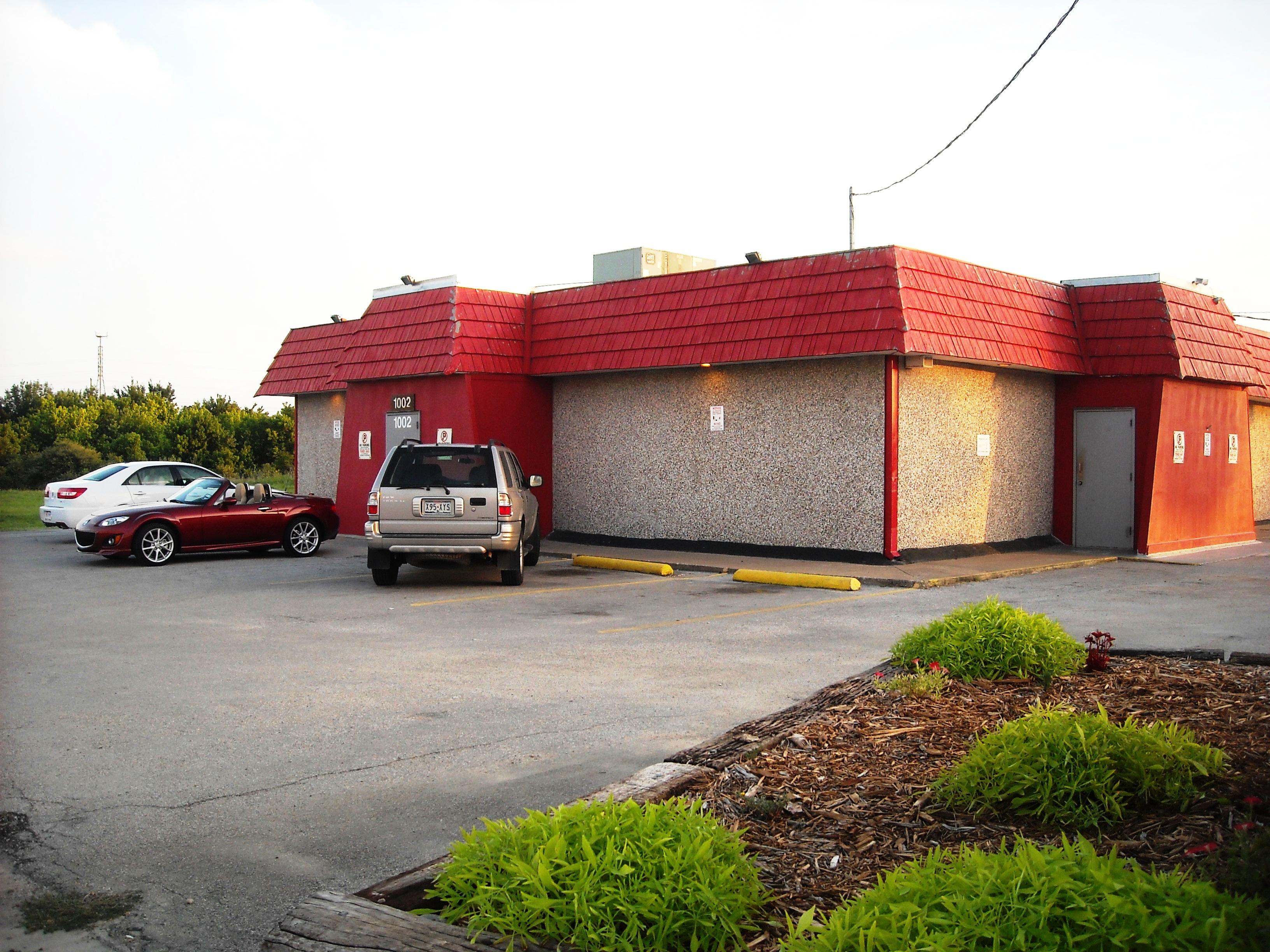 Look for the bright red roof!