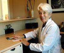 Janet Barrows Acupuncturist at desk