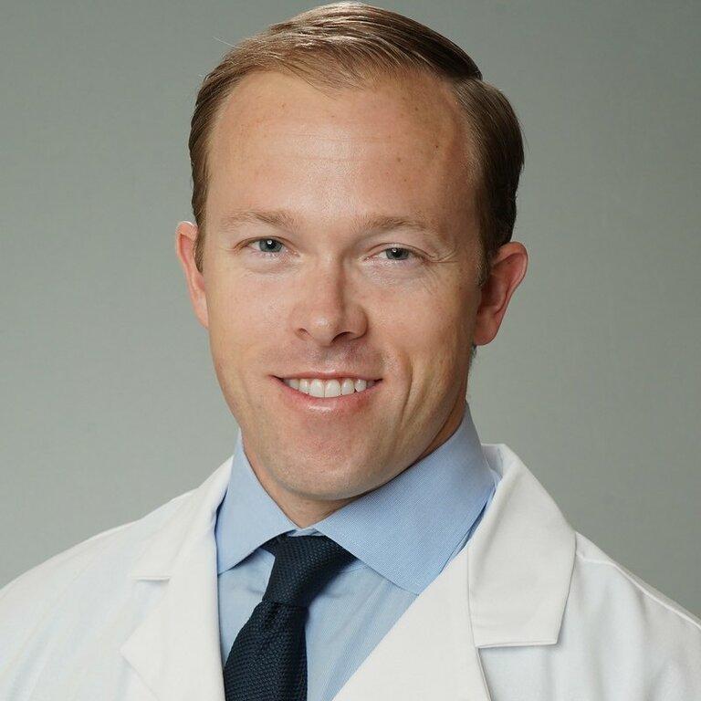 John A Buza, MD