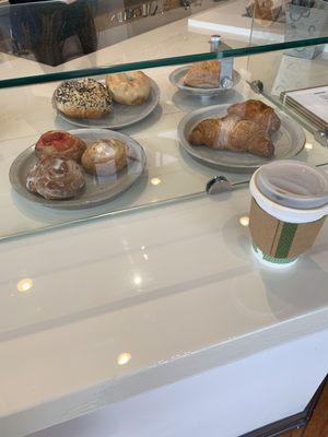 Scrumptious pastries complement their black coffee perfectly. They're made from a bakery in Tremont.