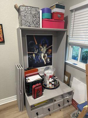 Art supplies organization shelf.