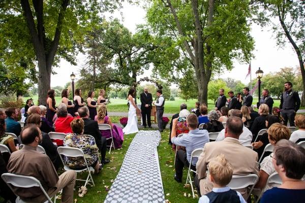 An outdoor wedding on the beautiful grounds of the Cary Country Club