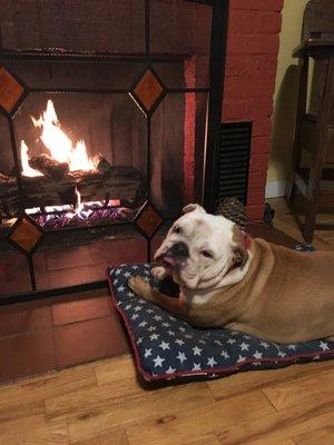 May enjoying a cozy fire at the office