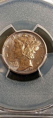 This one is a 1941-S Mercury Dime, with a beautiful toning, and some Mint errors, which they didn't even mention it.