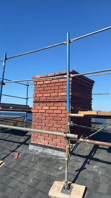 Beautiful brick and bluestone chimneys going up in Woods Hole, Cape Cod