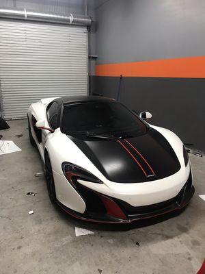 Red accents on bumpers and side skirts. satin black hood, roof, trunk and wing.