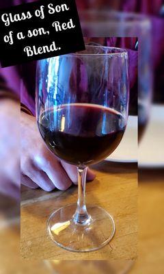 Glass of wine for our friend, who introduced us to Blue Line Pizza. It is Son of a son, Red Blend.