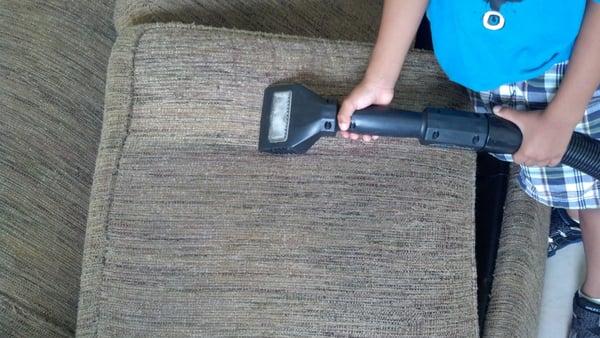 My son, Deron helping out one day, cleaning upholstery.