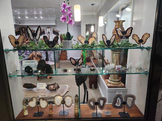 Collection of agate butterflies polished on both sides on stands.