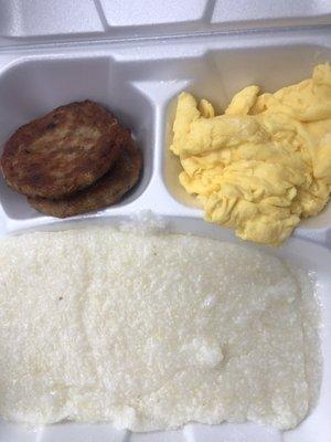 Two eggs with sausage, grits, and toast