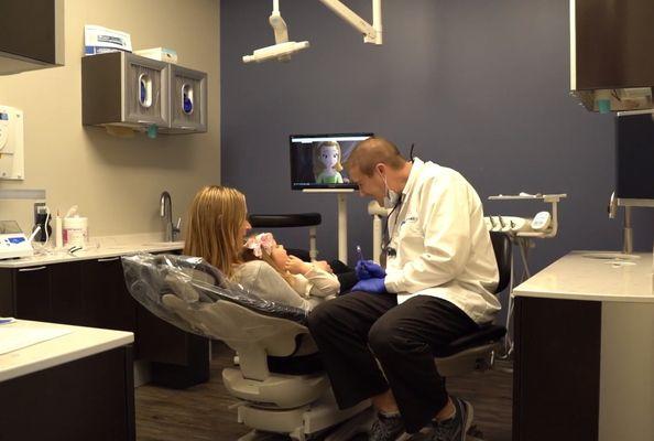 Dr Jacob Witer with pediatric patient at Witer Family Dentistry Washington MI