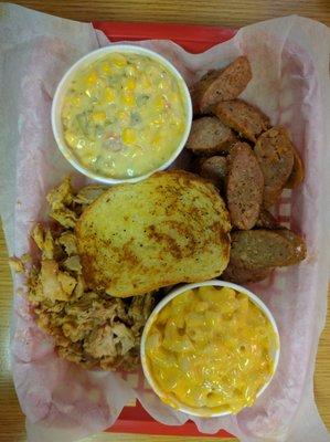 Dinner platter: sausage, chicken, Mac n cheese, jalapeno corn along with garlic bread