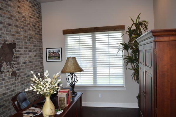 Study Room featuring Hunter Douglas Alustra Silhouette Shades in open position to allow light to filter through during the day.