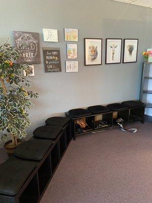 Our seating area will also keep your things close by during class or while you change out of your shoes before class.