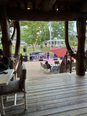 Outdoor music and seating under covered deck