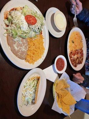 Crispy beef taco, burrito supreme, rice and beans, queso