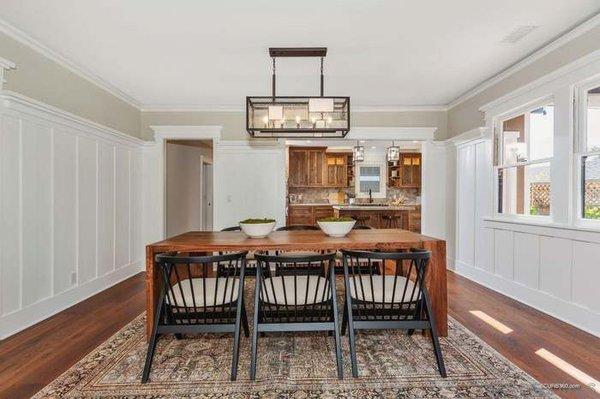 Tall paneling hugs this dining room.