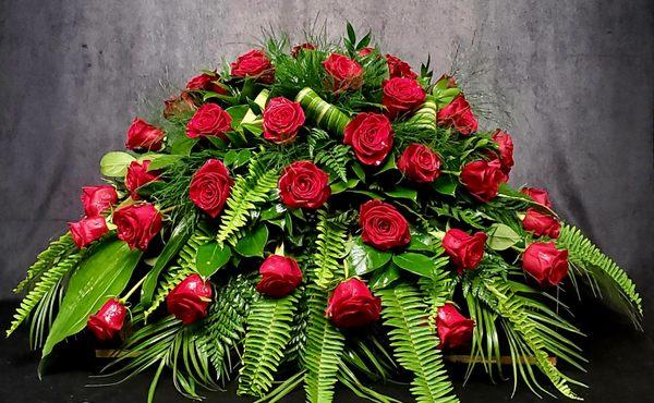 Red rose casket spray.