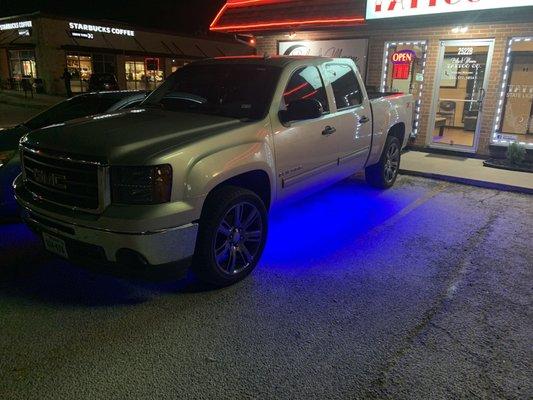 Smoked out headlights and taillights along with blue undercarriage lighting