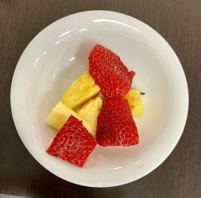 Fruit bowl or leftovers?
 3 measily pieces of strawberry and 4 small pieces of pineapple