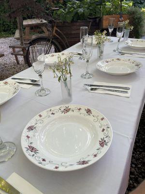 Tablescape in the backyard of the restaurant .