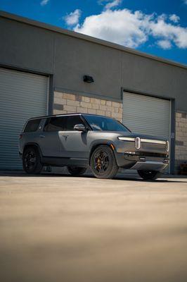 2023 Rivian R1S received our Xpel Stealth Paint Protection Film as well as our Xpel XR Plus Ceramic Window Tint!