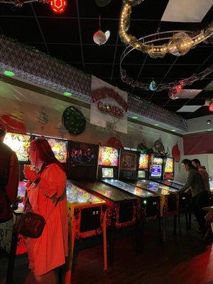 Wall of pinball machines