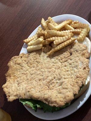 King sized breaded tenderloin and fries.  Crunchy on the outside moist and meaty on the inside