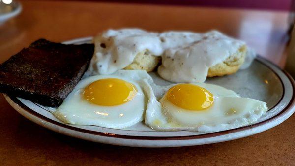 Two sunny side up eggs, gravy biscuit, and livermush, $7.95