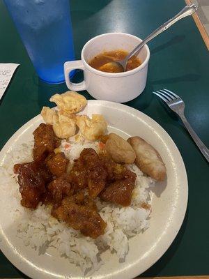 Sesame chicken, sweet and sour chicken, white rice, crab rangoons, hot and sour soup, a glass of water.