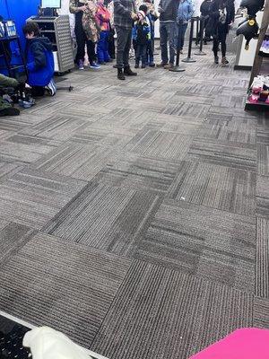 Line of people waiting to be helped while we wait for the employees to find our personal shoes they lost.