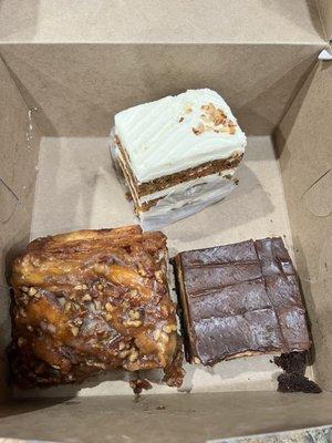 Carrot cake slice, buckeye brownie, and pecan sticky bun