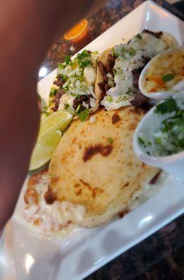 Bean and cheese papusa with carne asada tacos