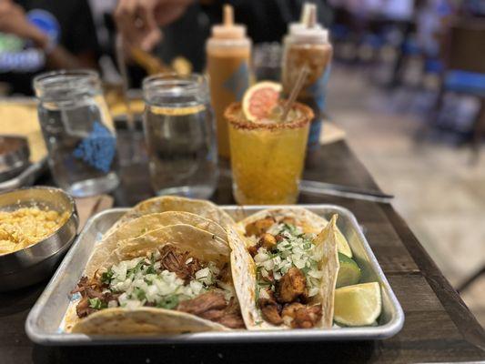 Two grilled chicken tacos and one beef  Mango passion fruit margarita