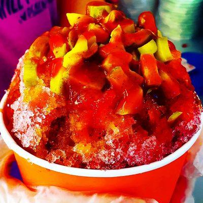 Piccadilly shaved ice. Cherry or any other flavor type with pickle chunks,  chamoy, and Tajin