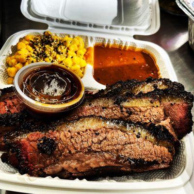 Brisket Plate, Texas style. Served on a bed of rice or sliced white bread, and your choice of sides.